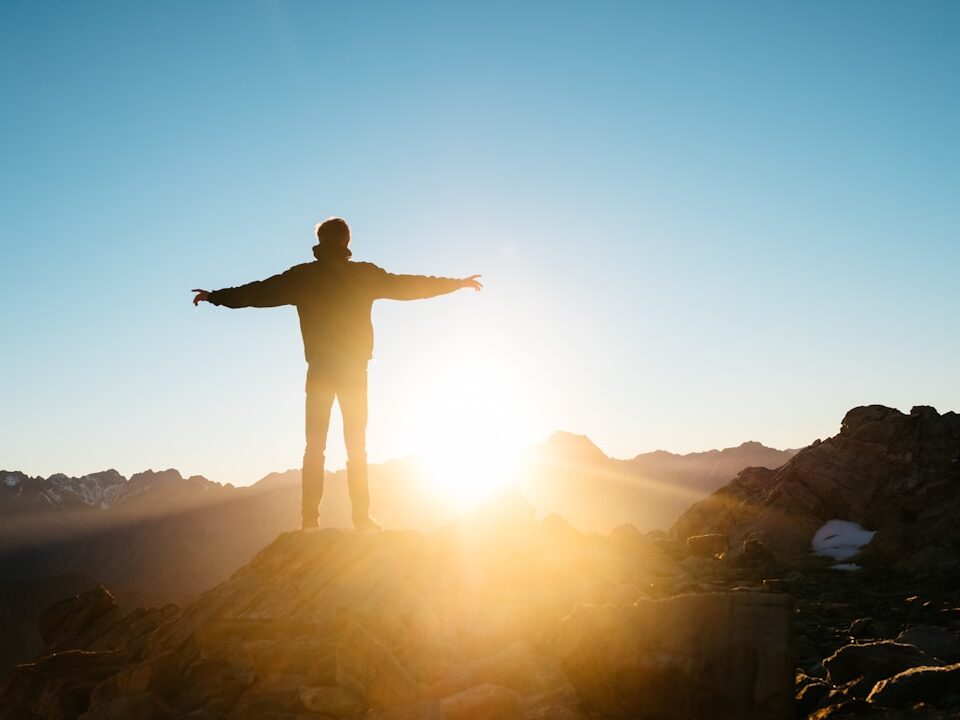 person standing on hill